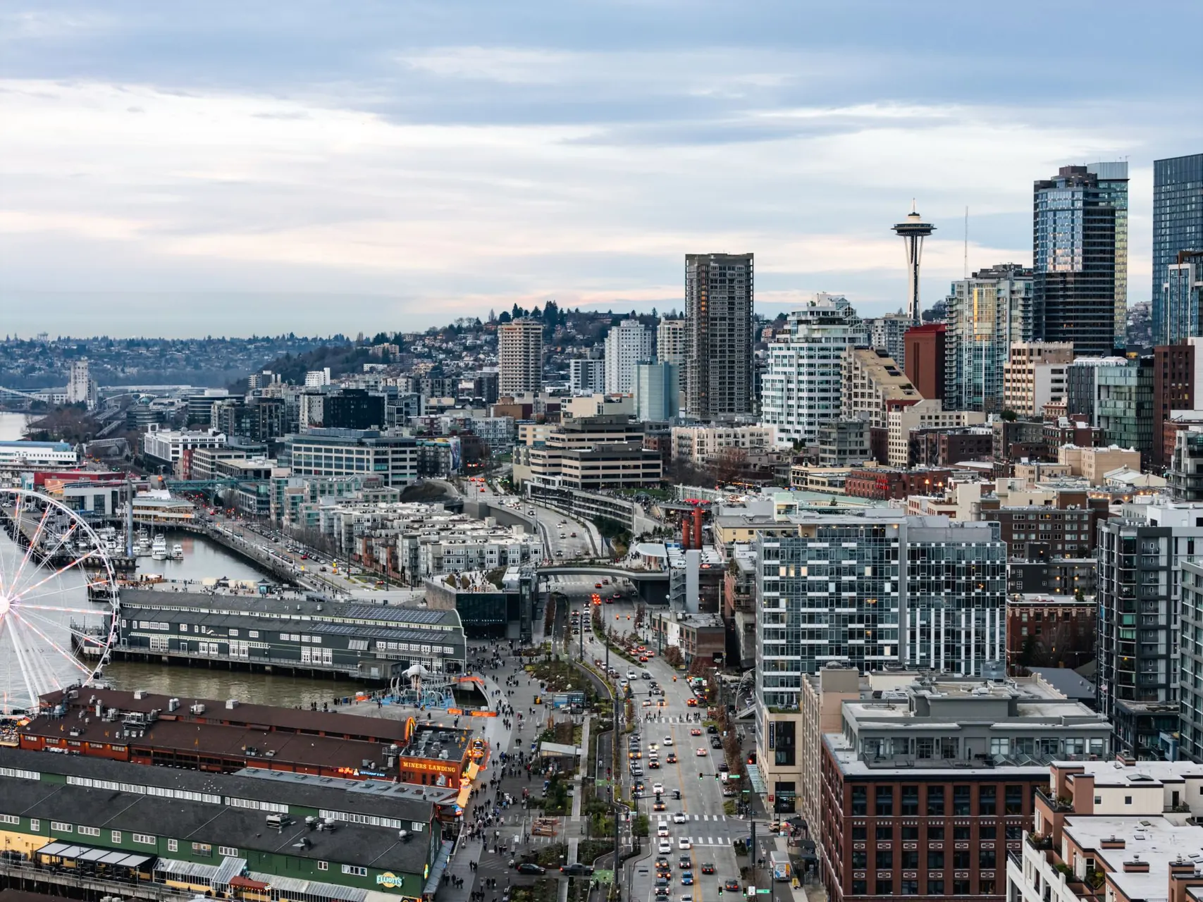 Downtown Seattle from the air, with the Space Needle and the waterfront Ferris wheel.